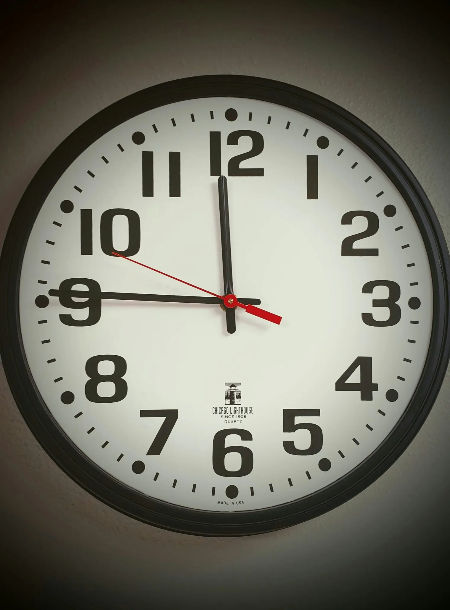 A close-up analog wall clock